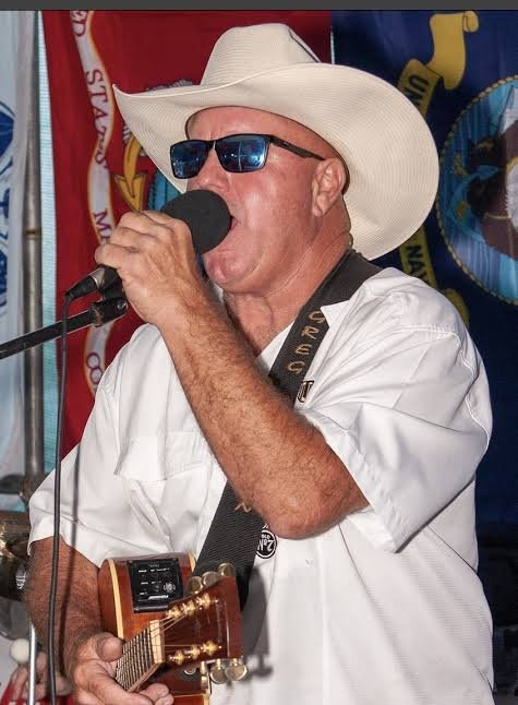 Rowdy Jameson performing with guitar